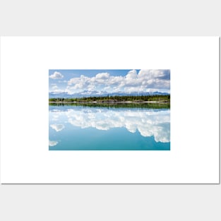 Yukon wilderness cloudscape reflected on calm lake Posters and Art